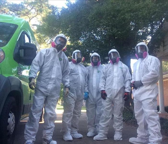 SERVPRO professionals lined up in their hazard gear.